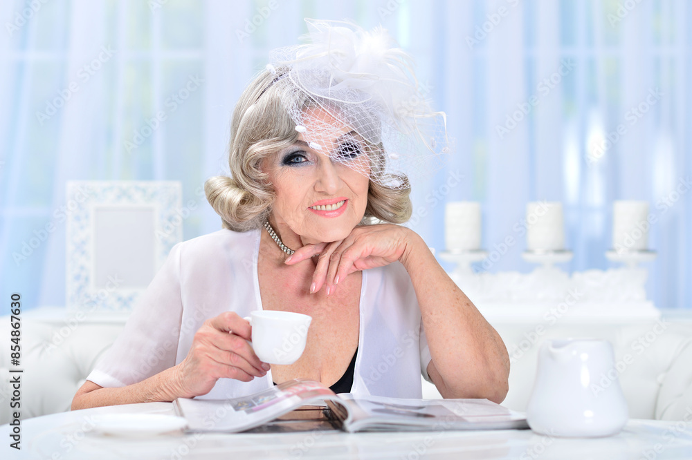Portrait of happy senior woman posing at home Portrait of happy senior woman posing at home