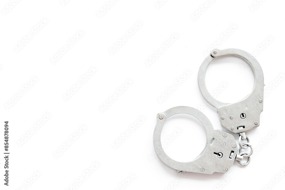 Police metal handcuffs top view. Criminal offense and detention concept Police metal handcuffs top view. Criminal offense and detention concept
