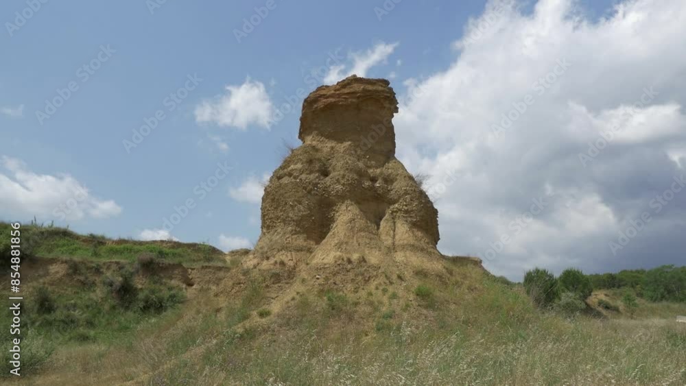 Wide shot of some curious dirt knolls that were left long ago in the suburbs of Terrassa to hold power lines Wide shot of some curious dirt knolls that were left long ago in the suburbs of Terrassa to hold power lines