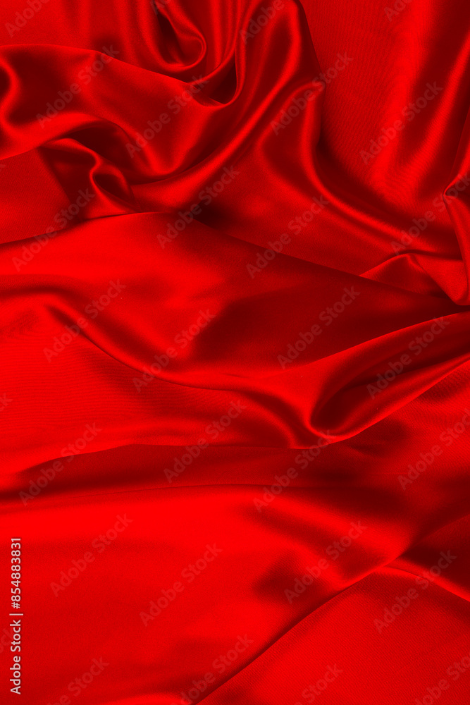Red silk or satin luxury fabric texture can use as abstract background. Top view. Red silk or satin luxury fabric texture can use as abstract background. Top view.