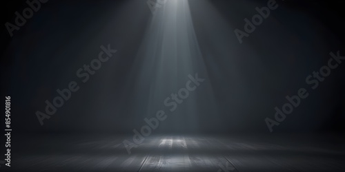 Dark, moody background with a spotlight shining down, creating a dramatic and atmospheric scene photo