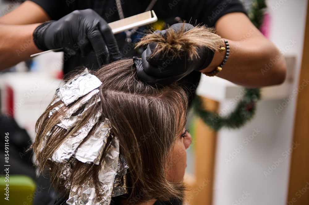 Fototapeta premium Hair coloring and highlights in modern beauty salon