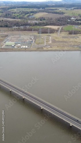 Helicopter view of a bridge crossing a lake countryside photo