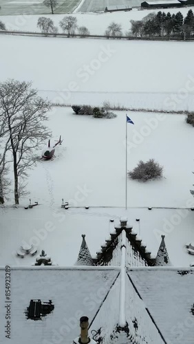 Castle Hotel Luxury Property estate countryhouse scotland scottish flag pole post forward drone aerial revealing helicopter parked in snow winter cold white landscape photo