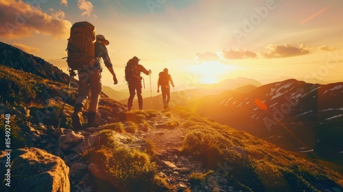 Hikers on a mountain trail at sunset