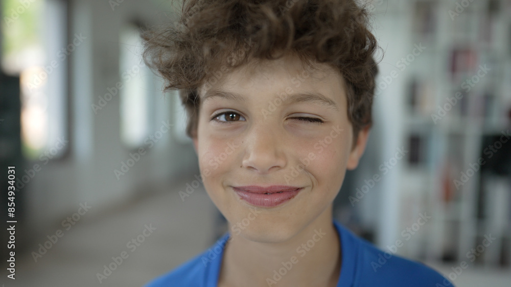 Cheerful Young Boy Smiling at Camera - Close-Up Portrait of Curly Haired Teen Cheerful Young Boy Smiling at Camera - Close-Up Portrait of Curly Haired Teen