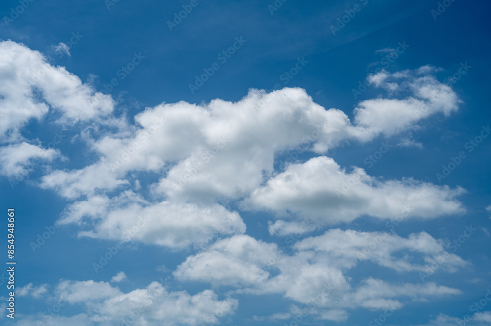 bright blue sky and scattered white clouds bright blue sky and scattered white clouds