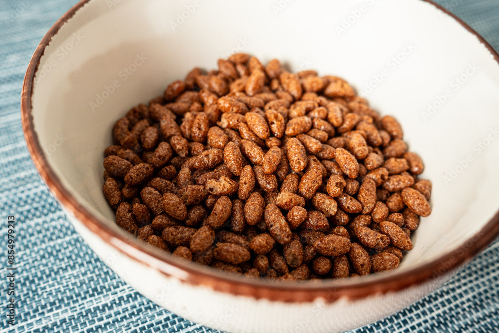 Puffed rice cereal with chocolate in a bowl Puffed rice cereal with chocolate in a bowl