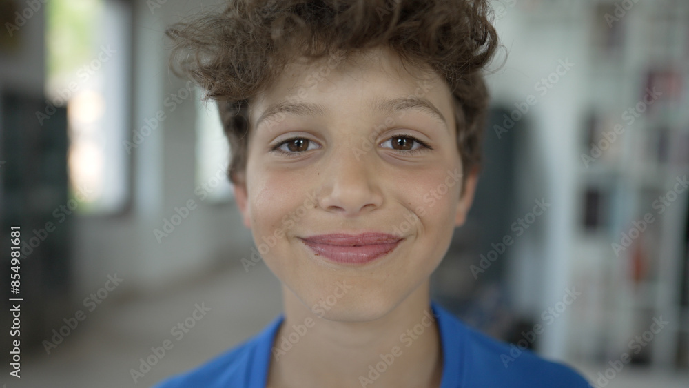 Happy Curly-Haired Boy Grinning - Natural Light Indoor Portrait Happy Curly-Haired Boy Grinning - Natural Light Indoor Portrait
