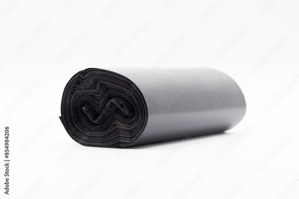 Black plastic garbage bags on white background, Roll of garbage bags on white background Black plastic garbage bags on white background, Roll of garbage bags on white background