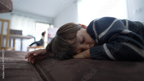 Peaceful Child Sleeping on Couch - Serene Domestic Moment Captured in a Family Home