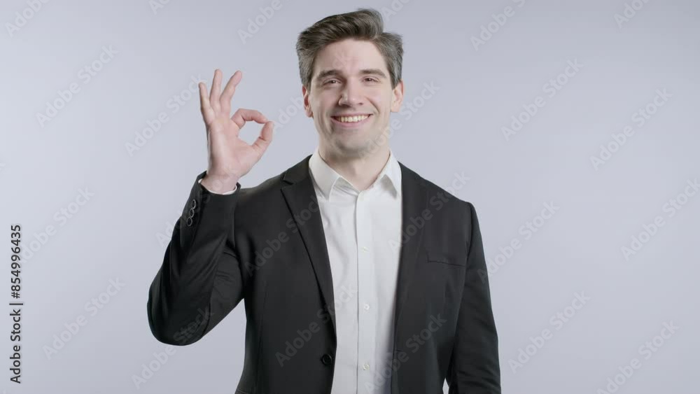 Positive mature businessman with OK, okay hand sign gesture. Happy man on white Positive mature businessman with OK, okay hand sign gesture. Happy man on white