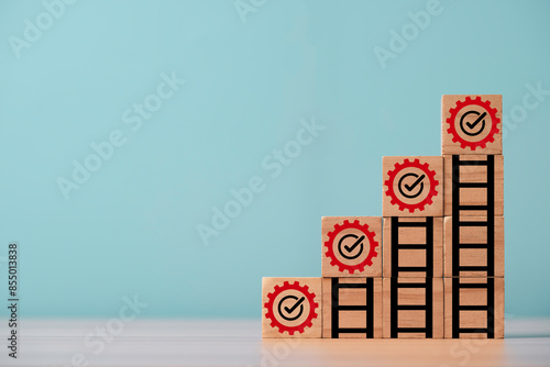 mechanical gear and increasing graph on the top of ladder step for continuous productivity improvement to get business profit growth and achievement objective  target concept.