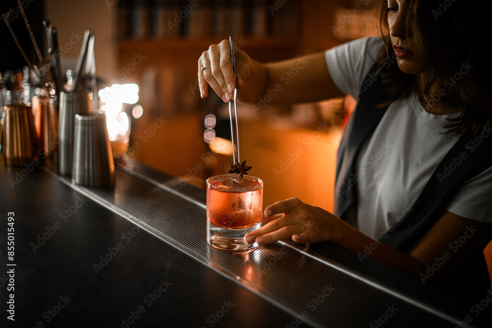 custom made wallpaper toronto digitalFemale bartender decorates pink cocktail with ice with vanilla flower