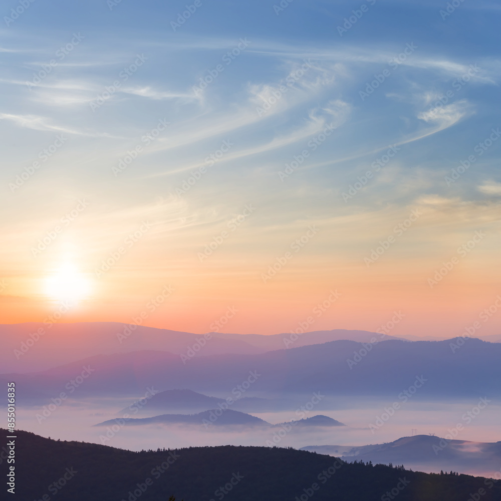 mountain chain silhouette in dense mist at the sunrise mountain chain silhouette in dense mist at the sunrise