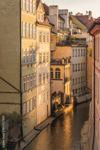 The Certovka, Devil's Canal, also called Little Prague Venice. Watermill in canal of Vltava river in Lesser Town in Prague, Czech Republic, Europe. photo