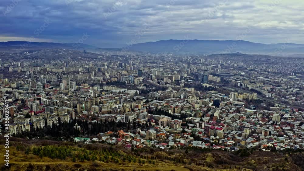 Overview Of Tbilisi City From Mount Mtatsminda In Georgia. aerial tilt-down shot Overview Of Tbilisi City From Mount Mtatsminda In Georgia. aerial tilt-down shot