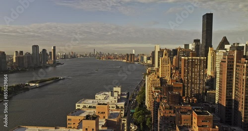 NYC New York Aerial v387 flyover Sutton Place capturing traffic on FDR drive, riverside Midtown Manhattan cityscape and UN building complex at sunrise - Shot with Mavic 3 Pro Cine - September 2023
