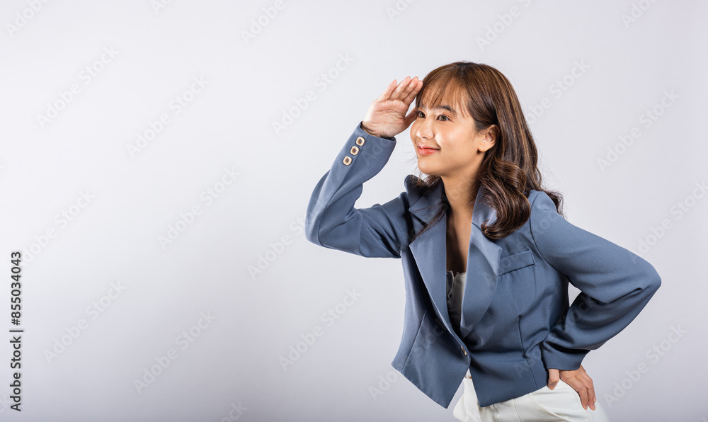 Searching concept. Asian business woman looking far away with hand over head at studio shot isolated on white background, Portrait of Happy female looking at distance with eyes shaded, copy space Searching concept. Asian business woman looking far away with hand over head at studio shot isolated on white background, Portrait of Happy female looking at distance with eyes shaded, copy space