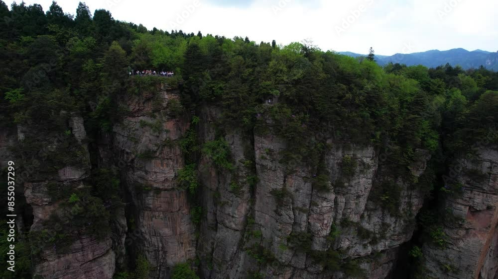 Contrast of crowded and lonely viewpoints in Huangshi Village to admire Zhangjiajie karst sandstone pillars, China. Aerial Contrast of crowded and lonely viewpoints in Huangshi Village to admire Zhangjiajie karst sandstone pillars, China. Aerial