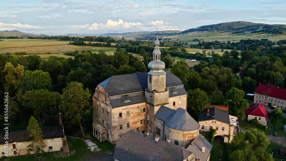 Sarny Palace (Schloss Scharfeneck) - 16th Century Palace In Sarny, Klodzko County, Poland. aerial orbiting shot Sarny Palace (Schloss Scharfeneck) - 16th Century Palace In Sarny, Klodzko County, Poland. aerial orbiting shot