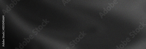 Elegant black fabric gradient noise grain background, with soft folds, perfect for design, luxury themes, or as a texture overlay. posters and advertising, templates, covers, banners.