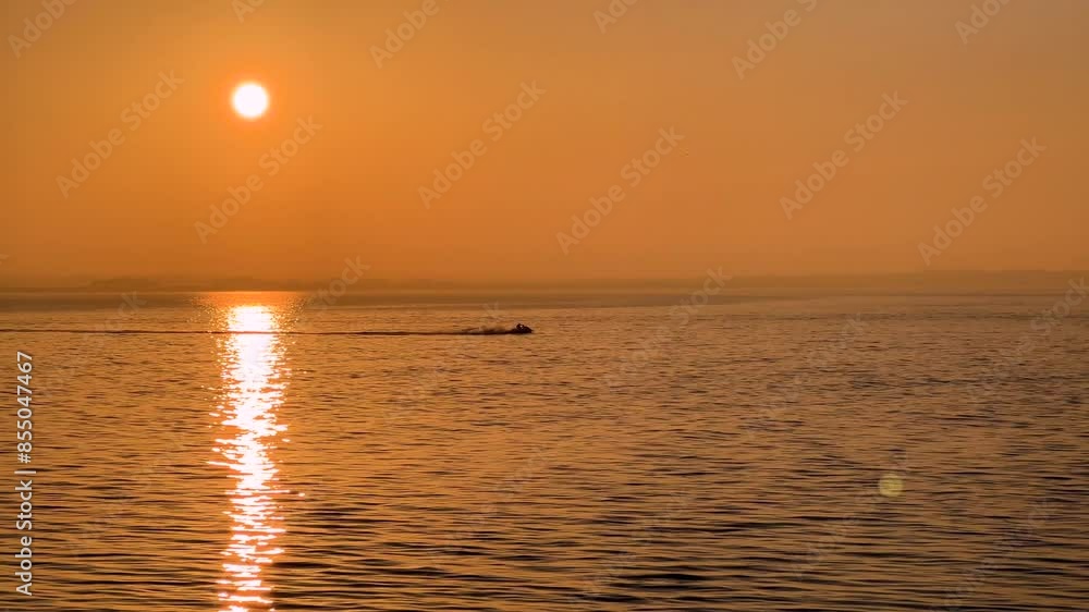 Sunset Jet Skiing: Fun on the Calm Ocean Sunset Jet Skiing: Fun on the Calm Ocean