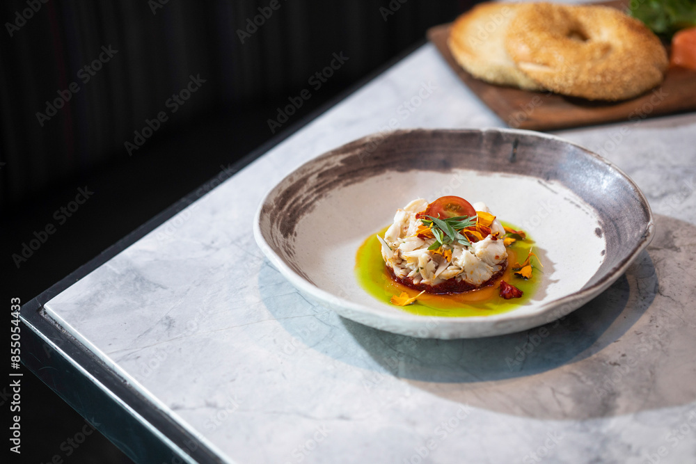 Crab cake dish in shallow bowl on table Crab cake dish in shallow bowl on table