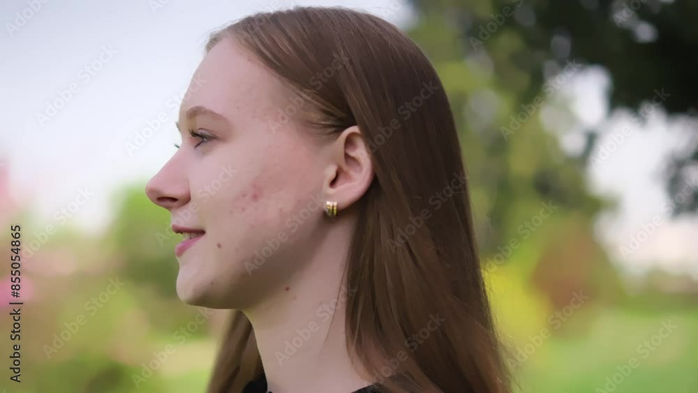 young woman against blurred natural background. Her expressions vary from thoughtful to smiling, capturing different aspects of her personality in serene outdoor setting young woman against blurred natural background. Her expressions vary from thoughtful to smiling, capturing different aspects of her personality in serene outdoor setting