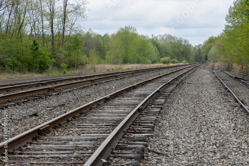 Multiple rows of bolted railroad tracks in landscape