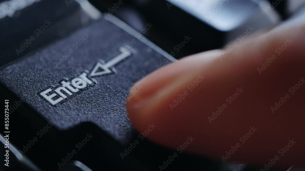 Close-up of finger press a key on the keyboard Enter, Macro shot of finger pressing Enter button on keyboard, Keyboard button Enter