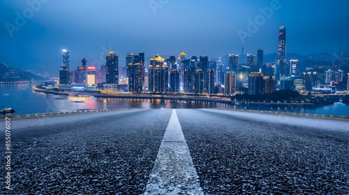 Illuminated high-rise skyline of a bustling metropolitan city at night with a river and bridge in