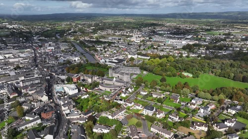 Kilkenny Castle, County Kilkenny, Ireland, September 2023. Drone at a higher angle orbits the estate while gradually descending with views north towards The Church of Saint John the Evangelist. photo