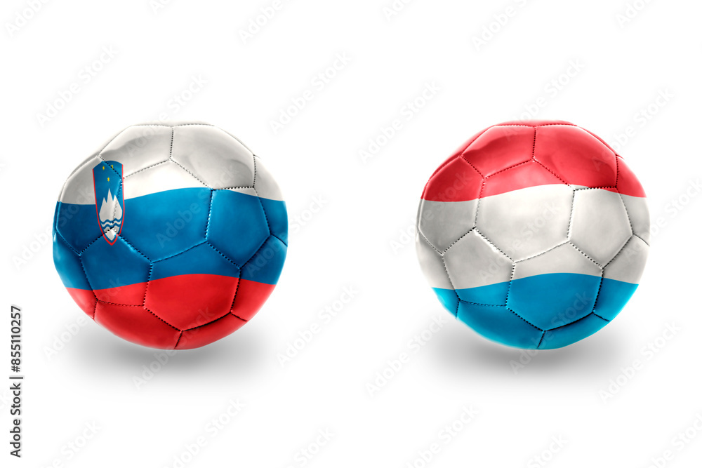 football balls with national flags of luxembourg and slovenia ,soccer teams. on the white background. football balls with national flags of luxembourg and slovenia ,soccer teams. on the white background.
