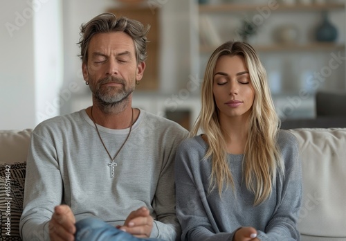 Older Man and Woman Relaxing Together on a Couch in a Modern Home