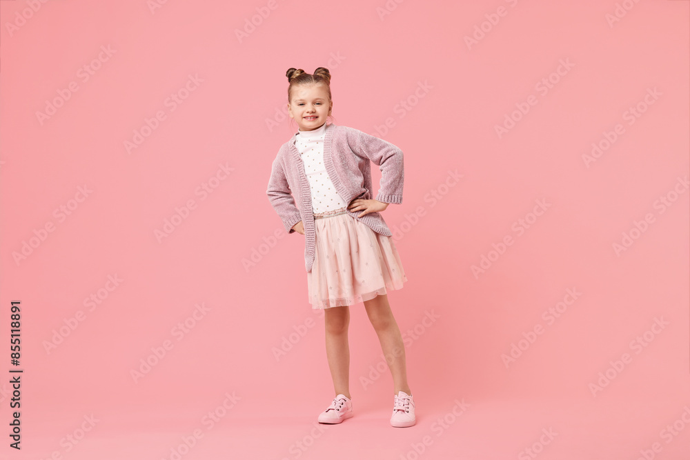 Cute little girl dancing on pink background Cute little girl dancing on pink background