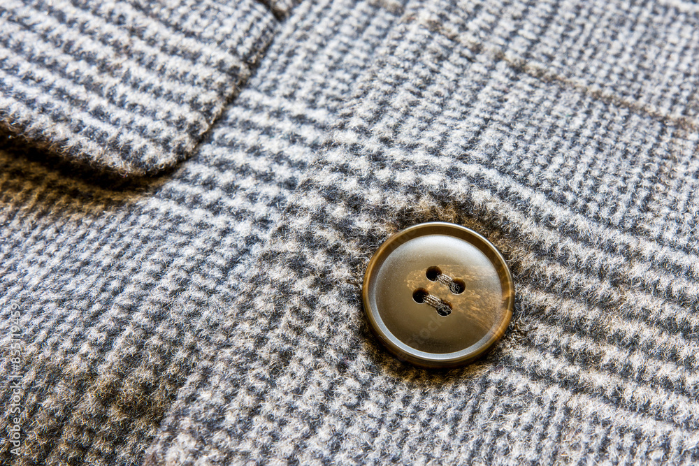 Close-up of a button on a garment.
Close-up of a button on a garment.