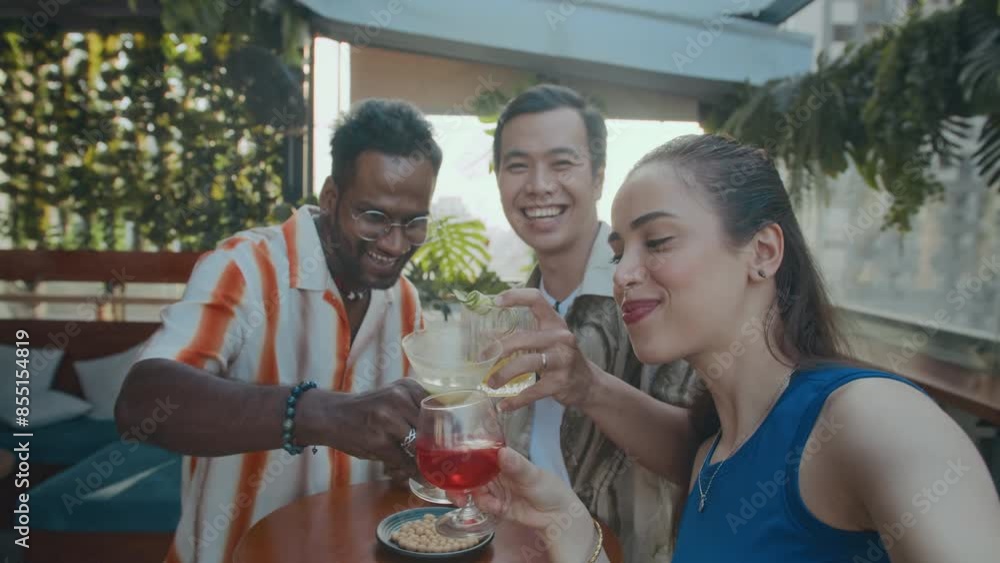 POV of three cheerful bi-ethnic friends posing for selfie while meeting at bar POV of three cheerful bi-ethnic friends posing for selfie while meeting at bar
