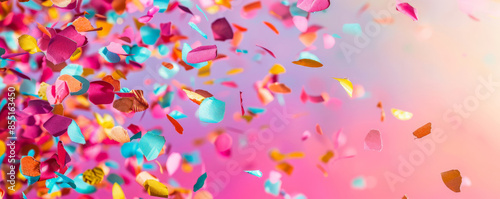 Bright background with vibrant, multicolored confetti scattered. © wolfhound911