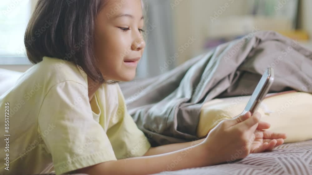 Adorable asian kid girl says hello and goodbye with her family via smartphone, her cheerful shows impact of digital communication, online connection, and wireless technology in daily life. Adorable asian kid girl says hello and goodbye with her family via smartphone, her cheerful shows impact of digital communication, online connection, and wireless technology in daily life.