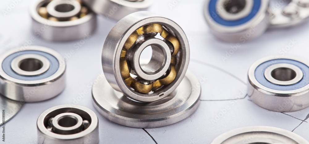 different bearings on blue print background. Part of mechanism. different bearings on blue print background. Part of mechanism.