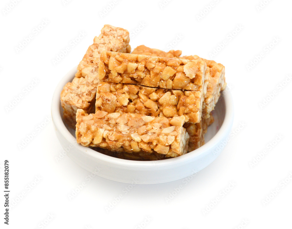 Honey bars with peanuts on white background Honey bars with peanuts on white background