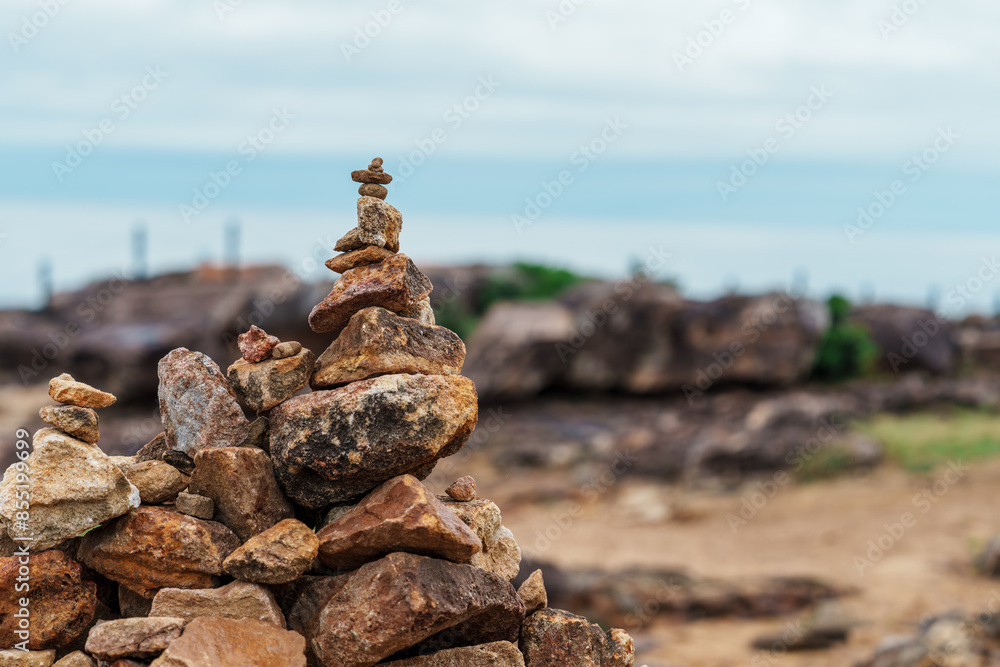 Small stones piled up on rocky terrain Small stones piled up on rocky terrain