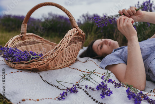 Girl rests enjoying in a lavender field photo