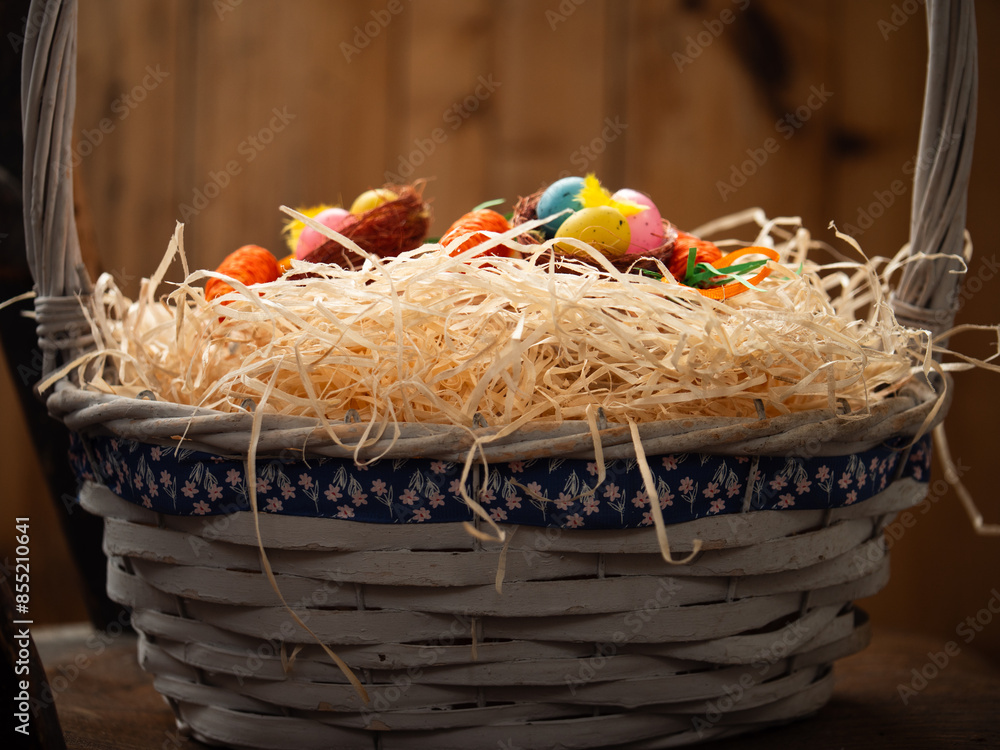 Fototapeta premium Easter decorations in woven basket m