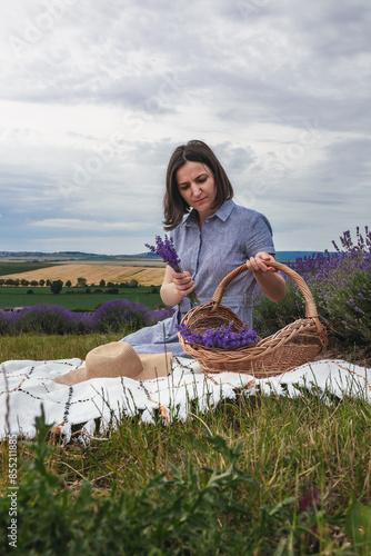 Girl rests enjoying in a lavender field photo