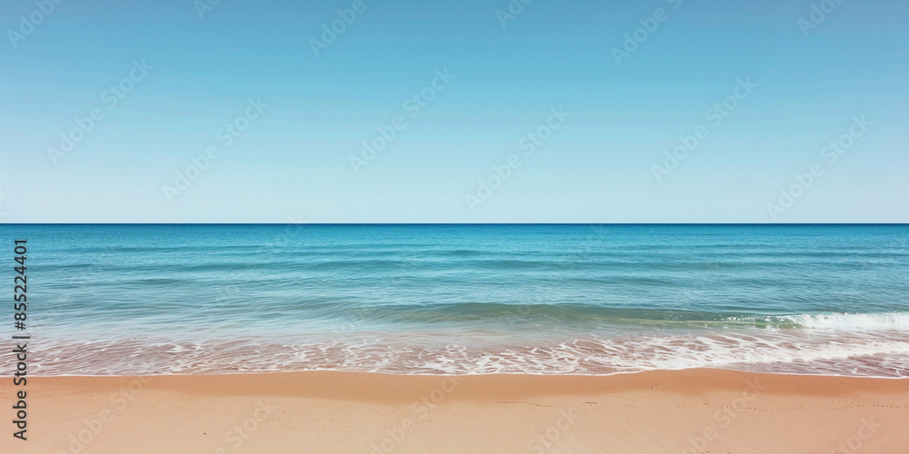 Beach with blue water and sand, with the horizon line in view Beach with blue water and sand, with the horizon line in view