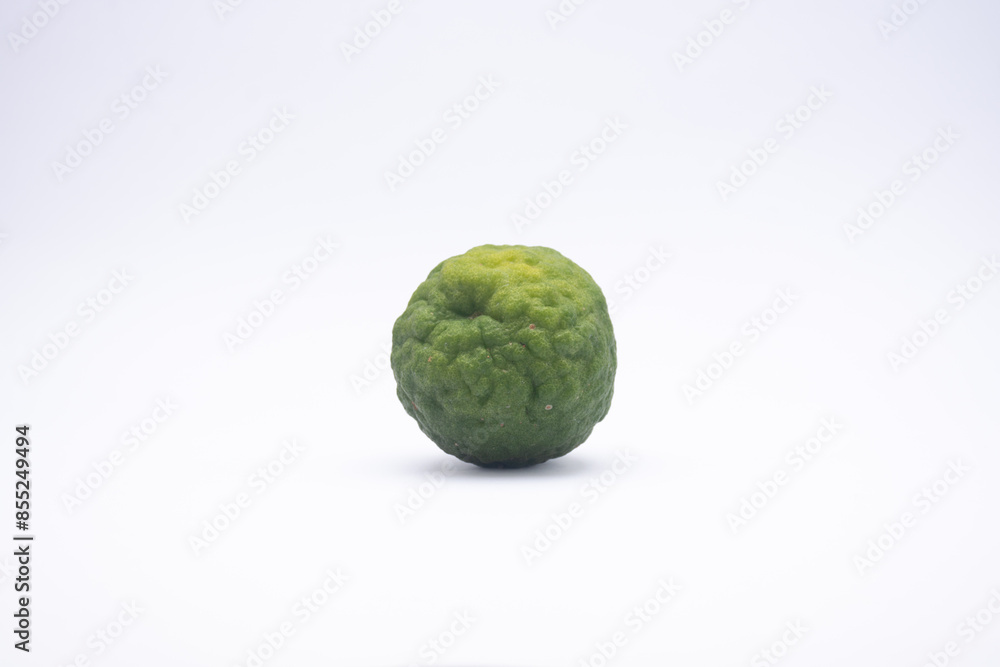 The kaffir lime is not yet ripe and green isolated on white The kaffir lime is not yet ripe and green isolated on white