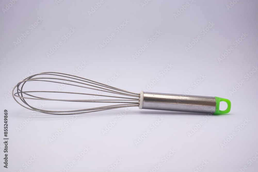 kitchen utensils, egg beaters made of stainless steel isolated on white
