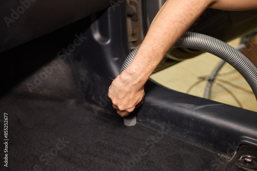 Konstfotografi Professional car interior vacuuming with handheld vacuum for thorough cleaning a